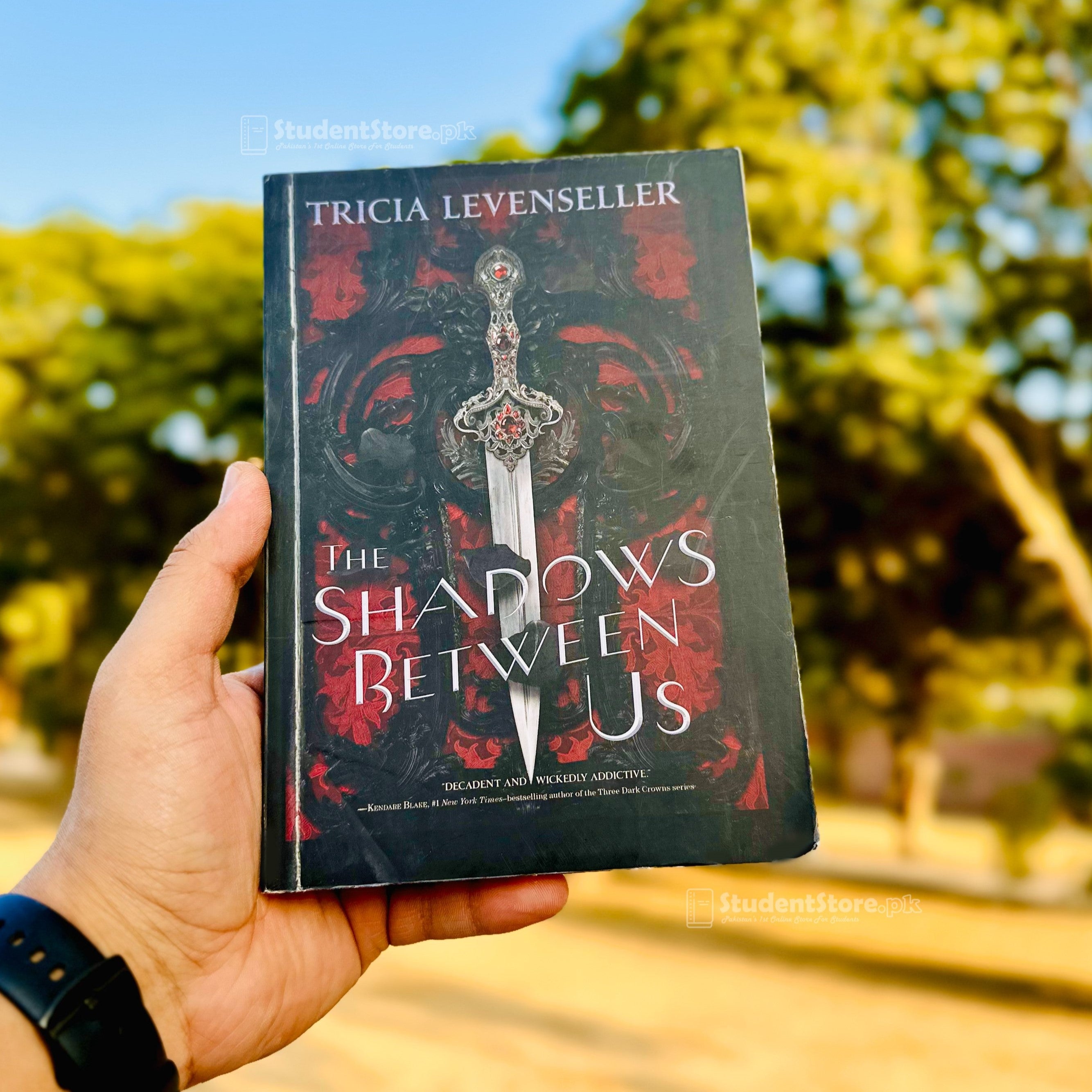 The Shadows Between Us by Tricia Levenseller – StudentStore.pk
